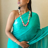 Statement necklace handcrafted with brass, kundan, pearls, enamel, and onyx slice tumbles