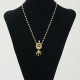Silver neckpiece paired with pearls, kundan and green onyx