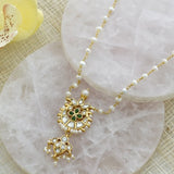 Silver neckpiece paired with pearls, kundan and green onyx