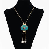 Turquoise kundan pendant paired with green fluroite & pearl beads
