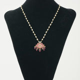Unique necklace made with pearls, silver, kundan, kemp stones, and red onyx