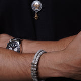 Black leather braided strap with silver and gold color embellishment