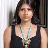 Himalayan Serenity: Sky Blue Thread Necklace with Tibetan Pendant & Jewel-Adorned Jhumki Drops" - Isaana Collection