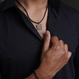 Leather chain with african brass pendant