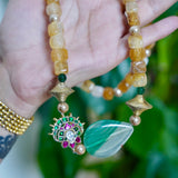 Yellow agate beads with a shaded green agate
