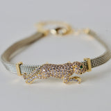 Silver and gold plated matt bracelet with jaguar embellishment