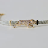 Silver and gold plated matt bracelet with jaguar embellishment
