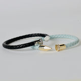 Black leather braided cuff with silver color embellishment