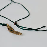 dark green cotton silk thread with brass pendant