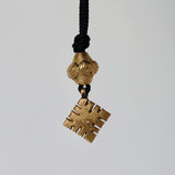 Blue cotton silk thread with brass pendant