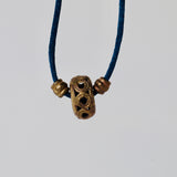 Black silk thread with african brass