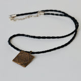 Leather chain with african brass pendant