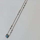 Evil eye cirlce in gold chain with swaroski stones