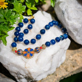 Signature beaded necklace with Tibetan side pendant and blue crystals