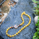 Signature beaded necklace with Tibetan Side pendant and Yellow beads