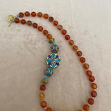 Beaded necklace paired with a Tibetan pendant on the side