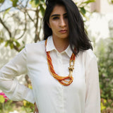 Lion pendant with warm orange ceramic and corals beads (African Collection)