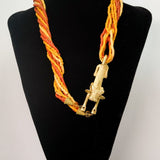 Lion pendant with warm orange ceramic and corals beads (African Collection)