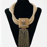 Jute necklace paired with a long Afghani pendant