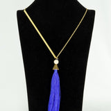 Gold plated neckpiece with a blue satin tassel (Ananya Collection)
