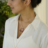 Unique necklace made with pearls, silver, kundan, kemp stones, and red onyx
