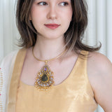 Beautiful pendant embellished with Labradorite stone in the center surrounded with garnet and amethyst on hasli