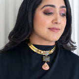 Intricately designed elephants on a brass hasli with a rectangular cut labradorite and rose quartz