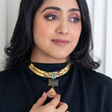 Intricately designed elephants on a brass hasli with a rectangular cut labradorite and rose quartz