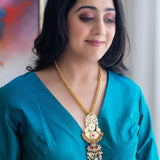 Long statement gold-plated necklace with kundan and green onyx stone