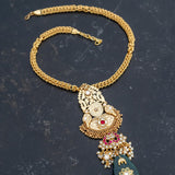Long statement gold-plated necklace with kundan and green onyx stone