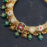 Gold plated necklace with beautiful kundan embellishment and hanging green onyx with embedded turquoise drops