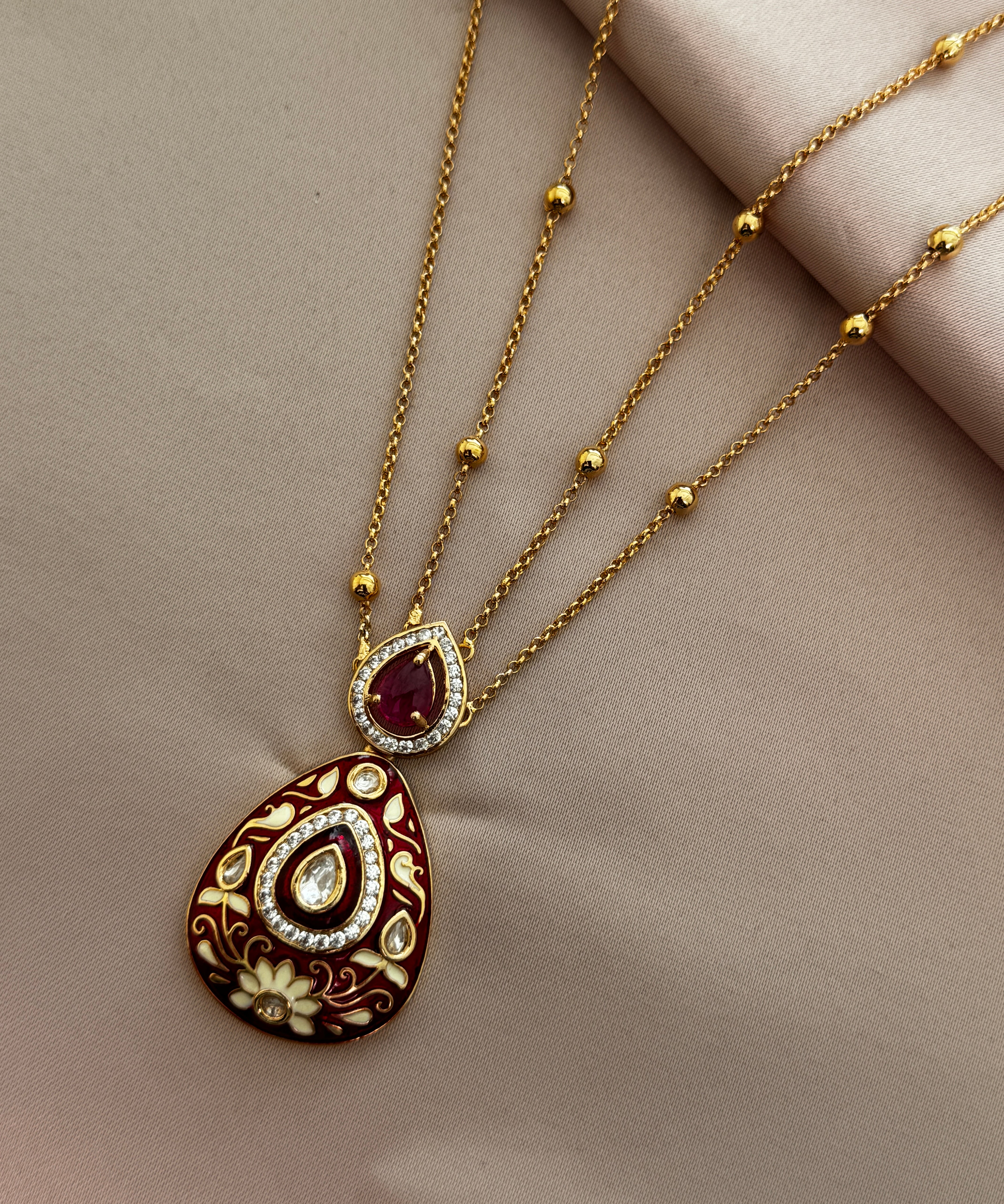 Kundan red drop cut Pendant set