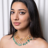 Ethinic golen necklace with green hued kemp stones : Isaana Collection