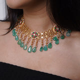 Ethinic golen necklace with green hued kemp stones : Isaana Collection