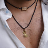 African brass in balck silk thread