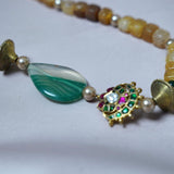 Yellow agate beads with a shaded green agate