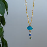 A stunning turquoise agate pendant in a beaded Long Chain