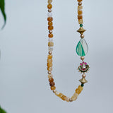 Yellow agate beads with a shaded green agate