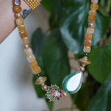Yellow agate beads with a shaded green agate