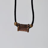 African brass in balck silk thread