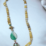 Yellow agate beads with a shaded green agate