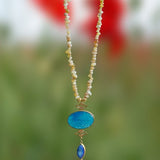 A stunning turquoise agate pendant in a beaded Long Chain