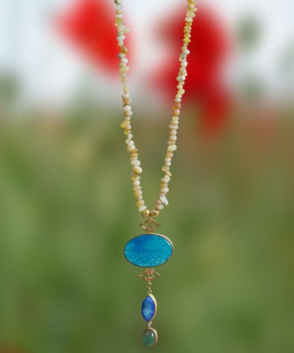 A stunning turquoise agate pendant in a beaded Long Chain